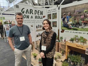 Antony Henn from Garden on a Roll and Katie Wood from VegTrug by an exhibition stand.