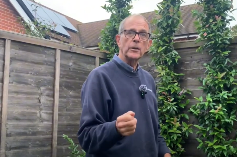 Ken Crowther near some fruit trees.