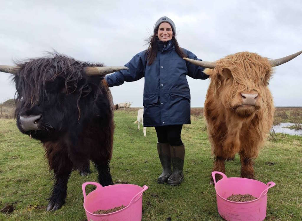 Chloe Lucas with her two highland cattle.