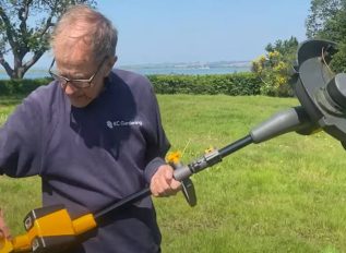 Pro-gardener making use of the strimmer