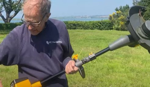 Pro-gardener making use of the strimmer